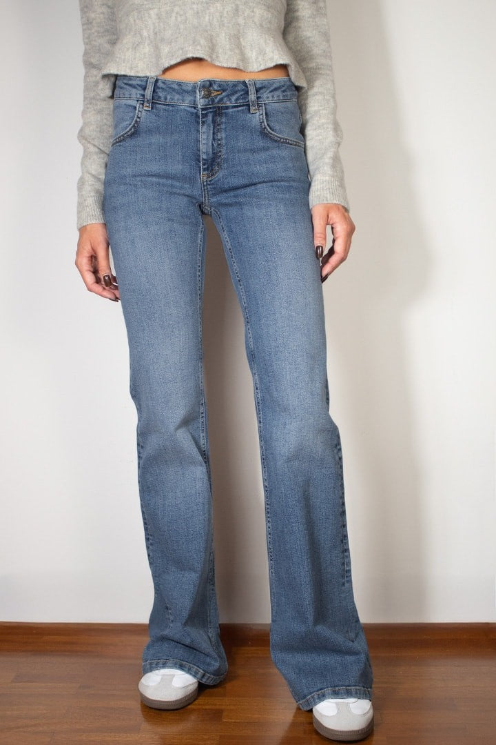 FLARED JEANS WITH STUDS AND EMBROIDERY